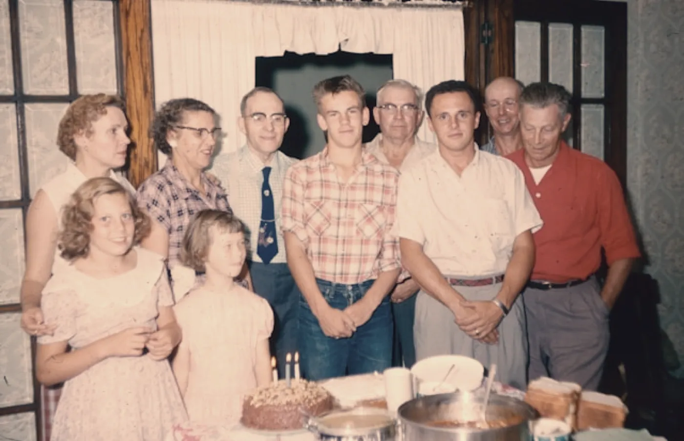 The same family photo around the cake, developed on the Vintage camera: everything pulled towards a warmer, softer tone.